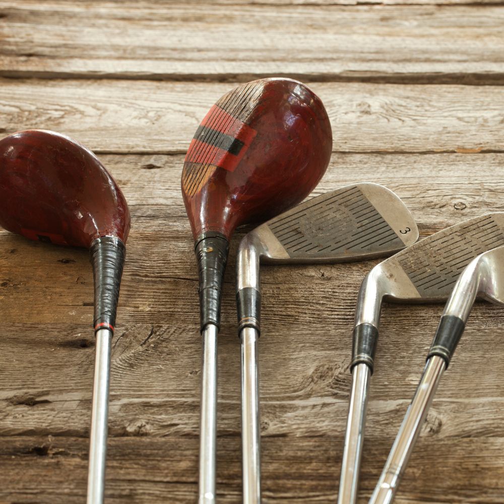 Golfers playing golf with a set of women's golf clubs